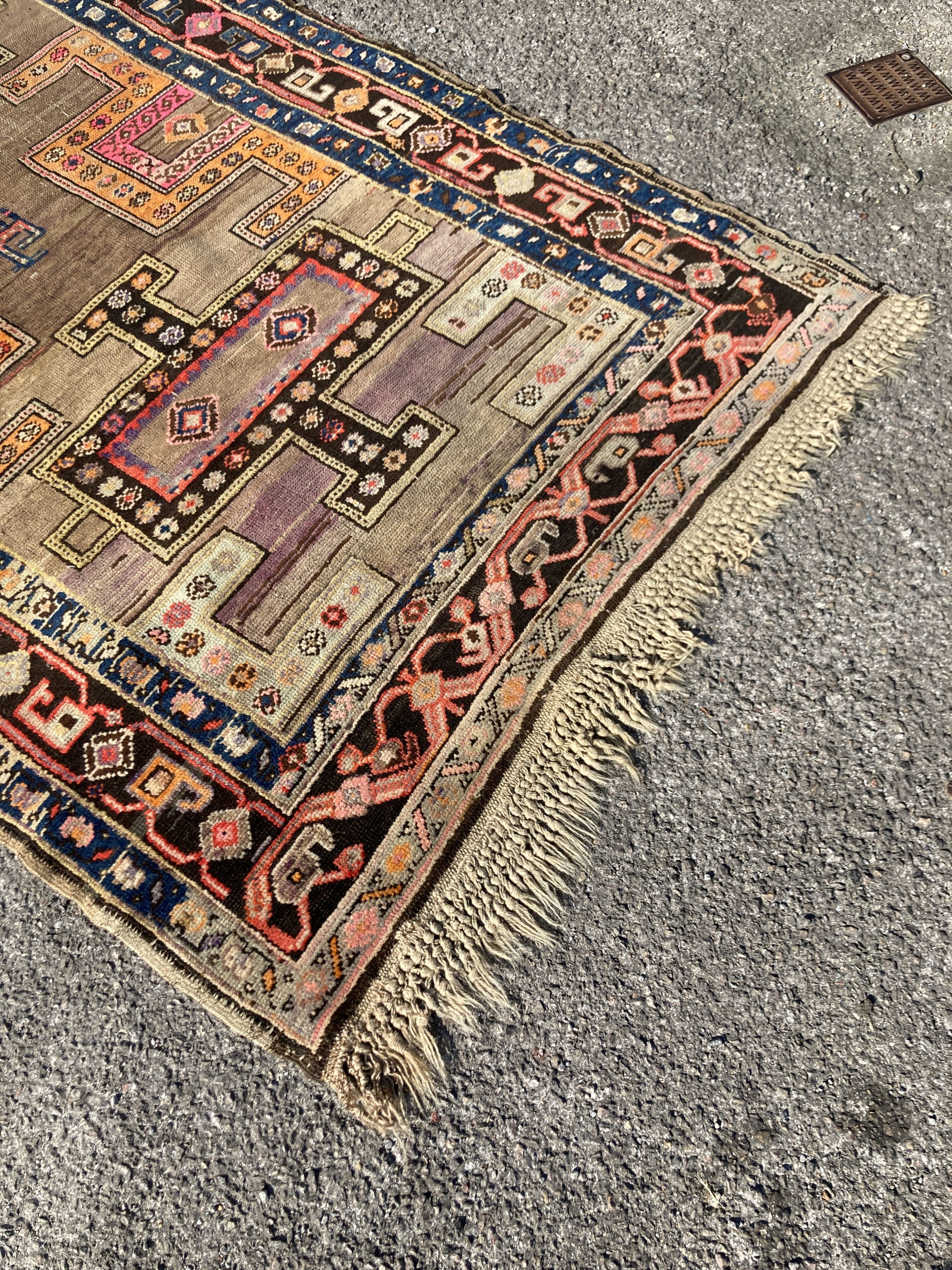 An early 20th century Caucasian Kazak hall carpet, 370 x 128cm